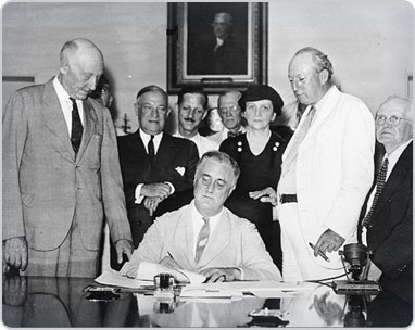 President Franklin D. Roosevelt signing the Social Security Act of 1935. Photo credit Social Security Administration